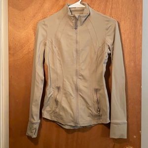 Tan athletic jacket like lulu zips up
